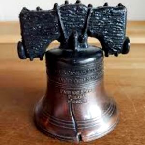 Liberty bell not sure how old but very heavy metal in exallant shape